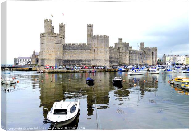 Caernarfon castle in Wales. Canvas Print by john hill