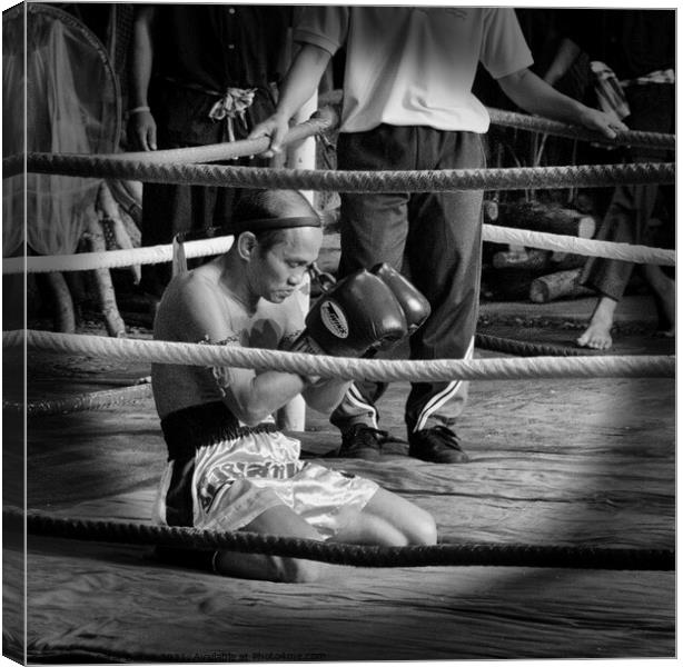 Muay Thai  boxer meditates before a bout. Bangkok, Thailand. Canvas Print by Peter Bolton