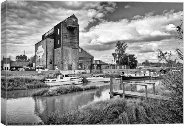 Old mill at Battlesbridge, now an antiques centre, River Crouch in foreground. Canvas Print by Peter Bolton