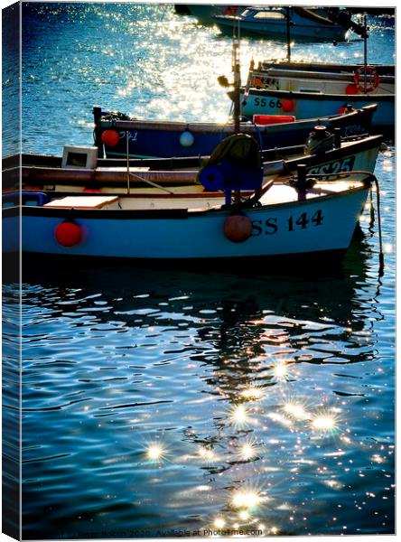 Small boats at anchor in St. Ives harbour with sun light and shadows. Cornwall. Canvas Print by Peter Bolton