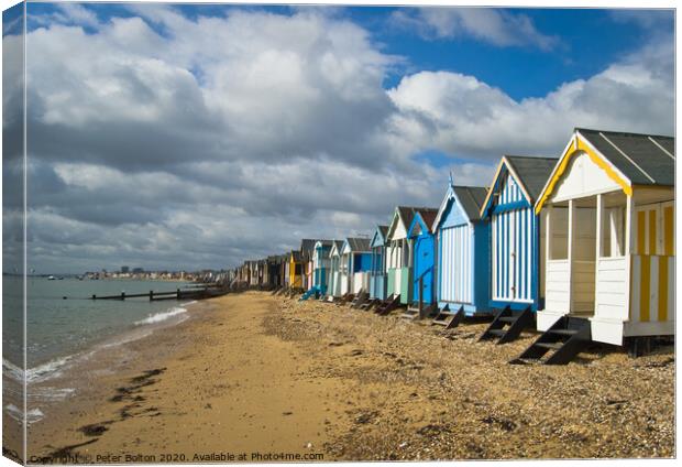 Beach huts at Thorpe Bay, Thames Estuary, Essex, UK Canvas Print by Peter Bolton