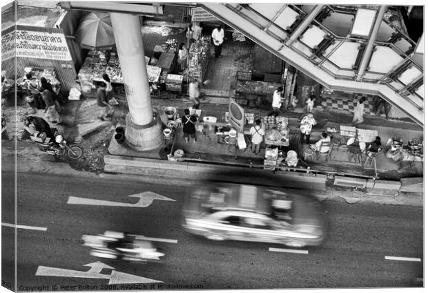 Black and white view from overhead of a street with food vendors and traffic. Bangkok, Thailand. Canvas Print by Peter Bolton
