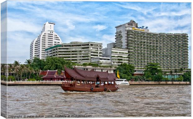 A tourist junk passing condominium towers on Chao Phraya river, Bangkok, Thailand. Canvas Print by Peter Bolton