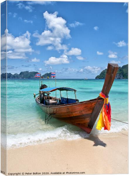Long-tail boat pulled up on the beach, Phi Phi Island, Thailand. Canvas Print by Peter Bolton