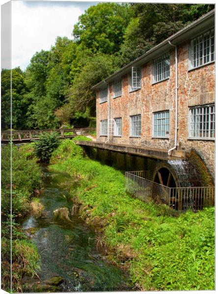 A working mill with waterwheel near Totnes, Devon, UK. Canvas Print by Peter Bolton