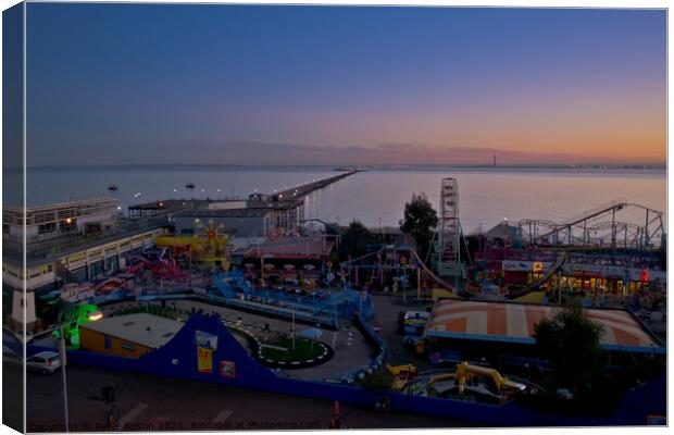 Evening view of the seafront at Southend on Sea showing 'Adventure Island' and the pier. Canvas Print by Peter Bolton