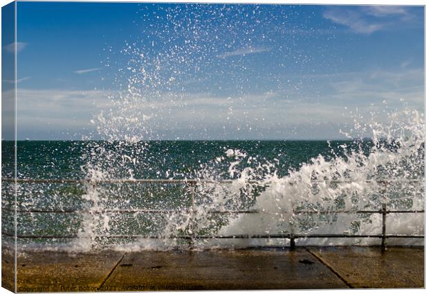 Waves braking over the seawall at The Garrison, Shoeburyness, Essex, UK. Canvas Print by Peter Bolton