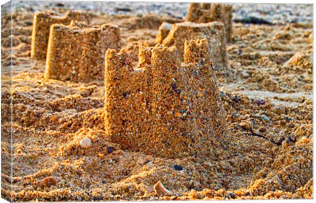Sandcastles on the beach at Thorpe Bay, Southend on Sea, Essex. Canvas Print by Peter Bolton