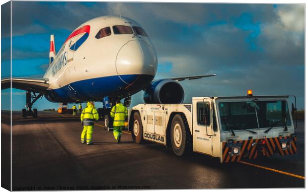 787 dreamliner and tow team Canvas Print by Peter Thomas
