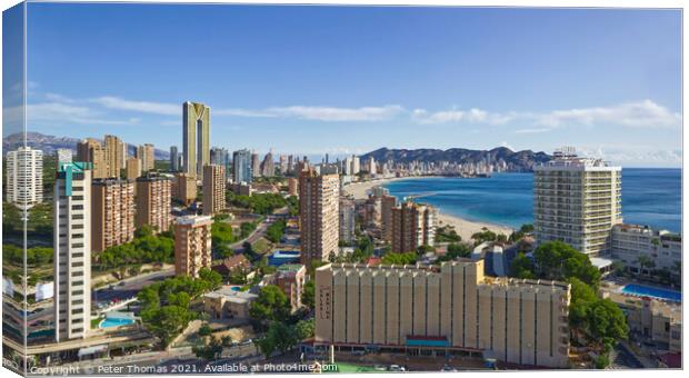 Majestic Sunset Over Benidorm Skyline Canvas Print by Peter Thomas