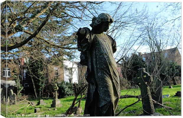 Stone Statue in Graveyard Canvas Print by Kevin Plunkett