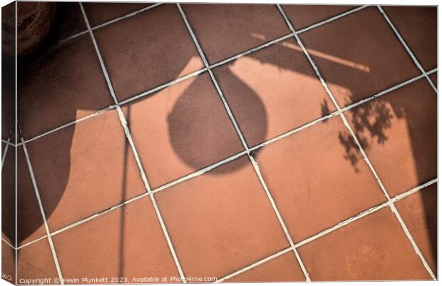 Shadows on floor tiles Canvas Print by Kevin Plunkett