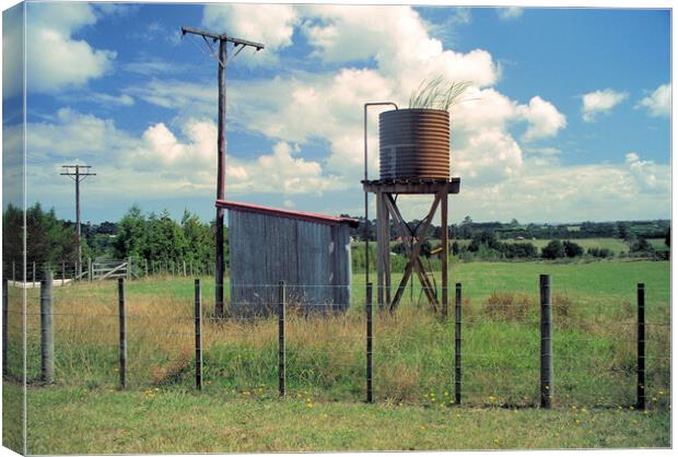 Unused water tank in the countryside in New Zealand Canvas Print by Kevin Plunkett