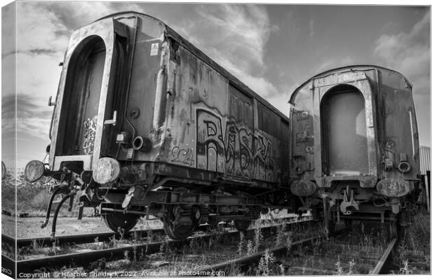 Rusty Railway Carriages with Graffiti Canvas Print by Heather Sheldrick