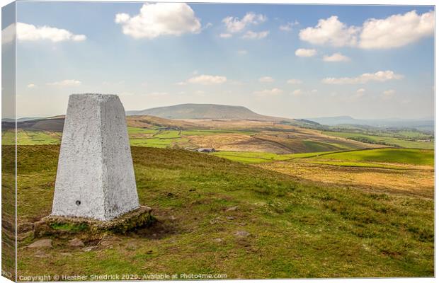 Trig Point on Weets Hill with Pendle Hill in Background Canvas Print by Heather Sheldrick