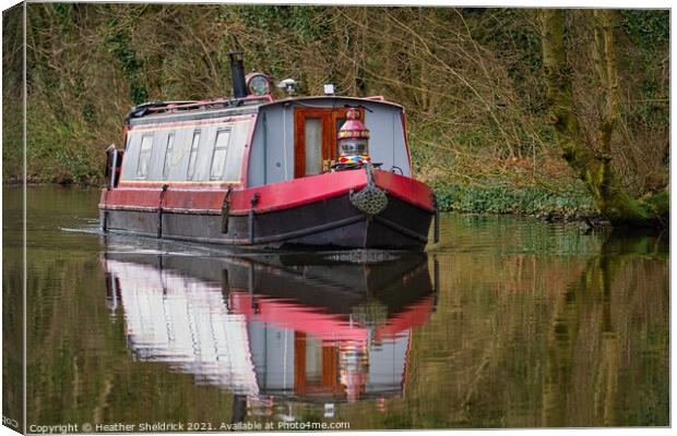 Narrowboat and Reflection on Canal Canvas Print by Heather Sheldrick