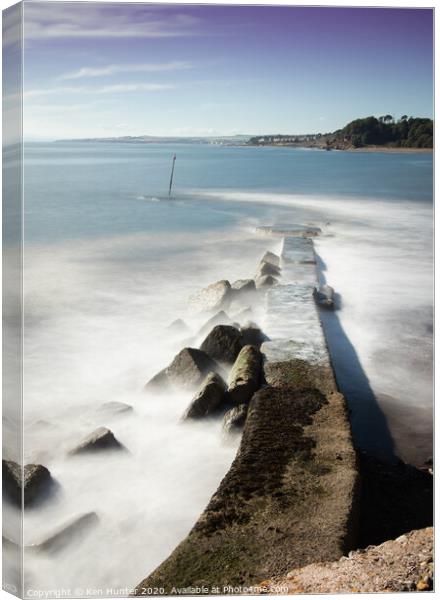 Milky Tide at Breakwater Canvas Print by Ken Hunter