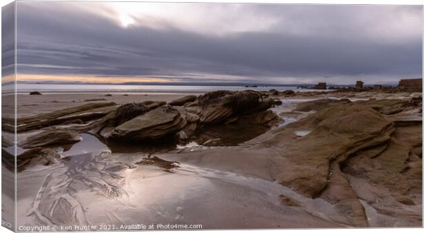 Beach Rock Rising Canvas Print by Ken Hunter