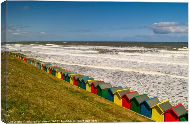Beach Huts, Whitby, North Yorkshire Canvas Print by Michael Shannon