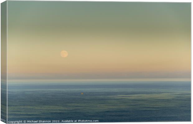 Full Moon Rising over the sea at Whitby Canvas Print by Michael Shannon