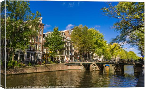 City Street and Canal Amsterdam, Netherlands Canvas Print by Michael Shannon