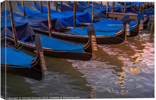 Gondolas Moored at the side of the Grand Canal Canvas Print by Michael Shannon