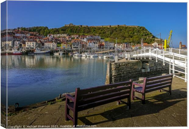 Scarborough Harbour under blue skies on a sunny da Canvas Print by Michael Shannon