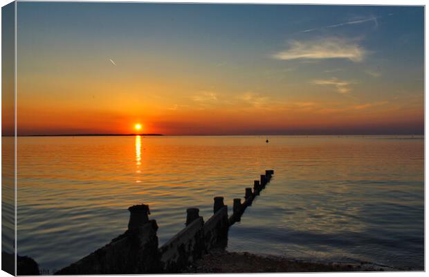 Setting sun in Whitstable Canvas Print by Jonathan Moulton