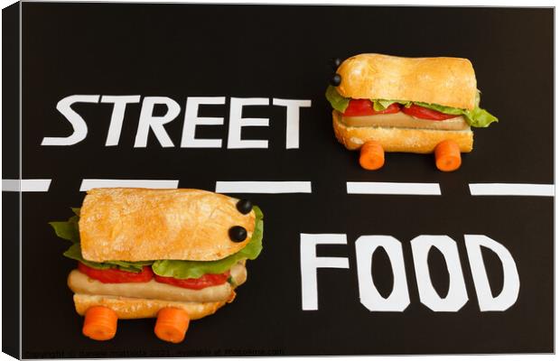 two sandwiches   shaped  car  represent the activity of street food Canvas Print by daniele mattioda