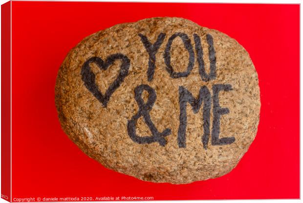 the english  writing you and me with a heart drawn Canvas Print by daniele mattioda