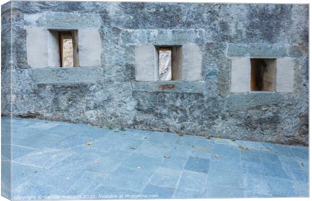 series of slits of an ancient castle Canvas Print by daniele mattioda