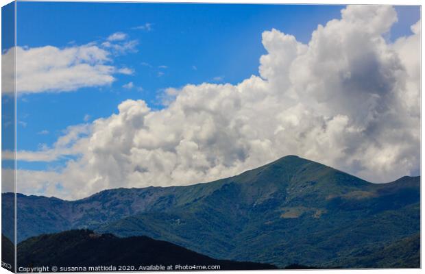 a landscaping symmetry of mountains and clouds Canvas Print by susanna mattioda