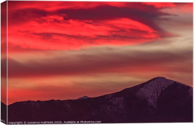 a spectacular red cloud above the mountains Canvas Print by susanna mattioda