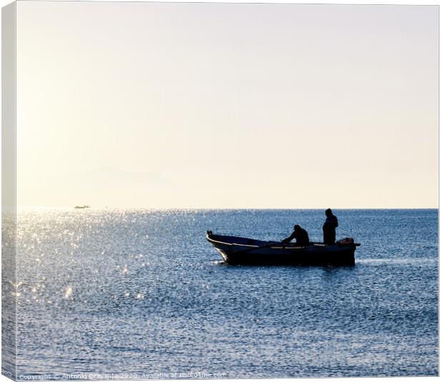 Fisherman boat in silhouette Canvas Print by Antonio Gravante
