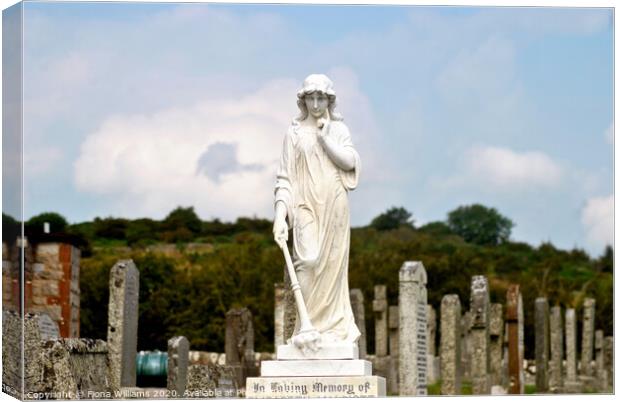Statue and graveyard Canvas Print by Fiona Williams