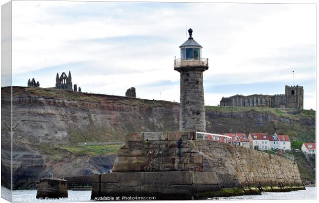 Whitby Abbey St Mary's Church and the lighthouse f Canvas Print by Fiona Williams