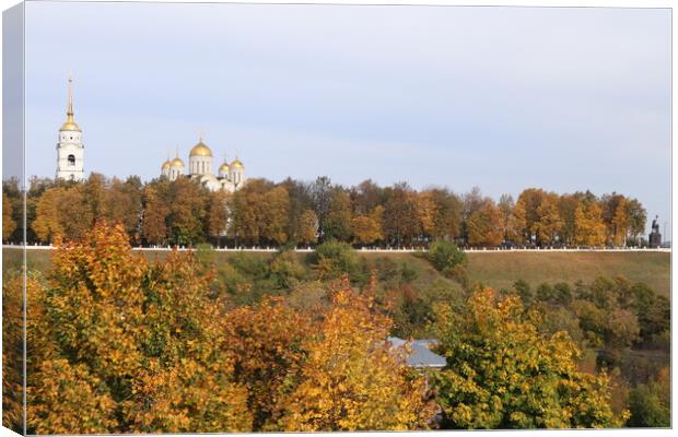 Autumn, trees with yellow leaves and a white Church with Golden domes. Canvas Print by Karina Osipova