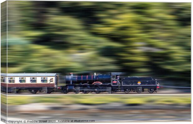 A train in motion  Canvas Print by Freddie Street
