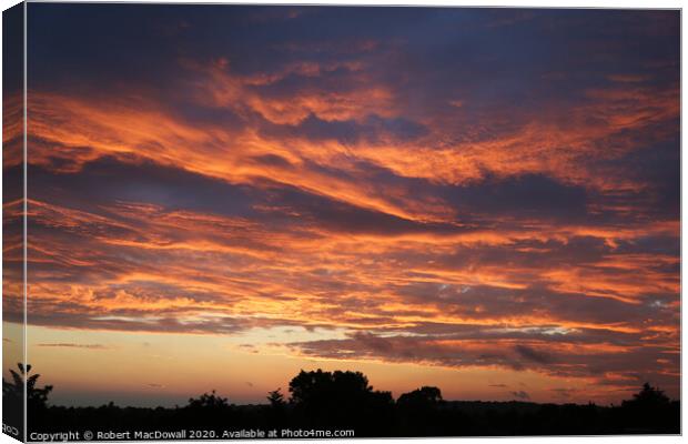 Flame sky over Essex Canvas Print by Robert MacDowall