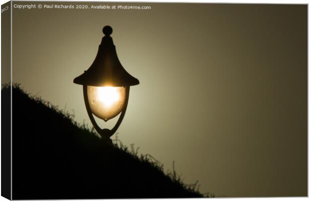 Lamplight at sunset Canvas Print by Paul Richards