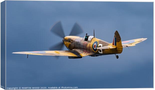 Spitfire into the Blue Canvas Print by MARTIN WOOD
