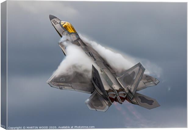 F-22 Raptor clouds Canvas Print by MARTIN WOOD