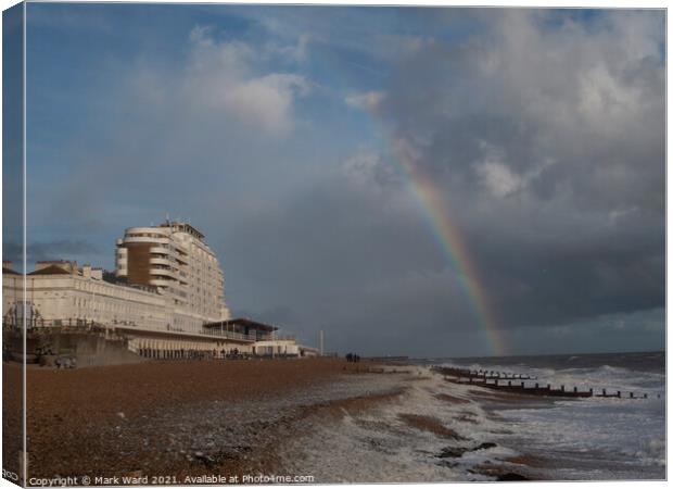 St Leonards Seafront with a Rainbow. Canvas Print by Mark Ward