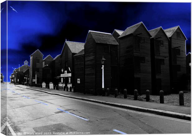 Glowing Hastings Net Huts. Canvas Print by Mark Ward