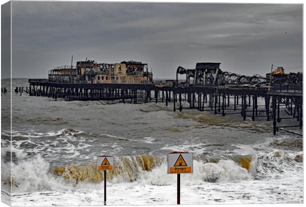 Fire Damage to Hastings Pier 2010. Canvas Print by Mark Ward