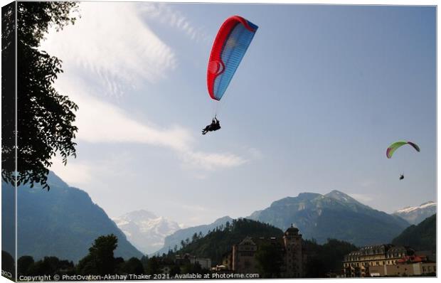 A group of people enjoying paragliding Canvas Print by PhotOvation-Akshay Thaker