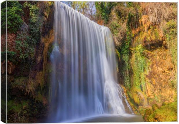 La caprichosa waterfall in stone monastery in long exposure Canvas Print by Vicen Photo