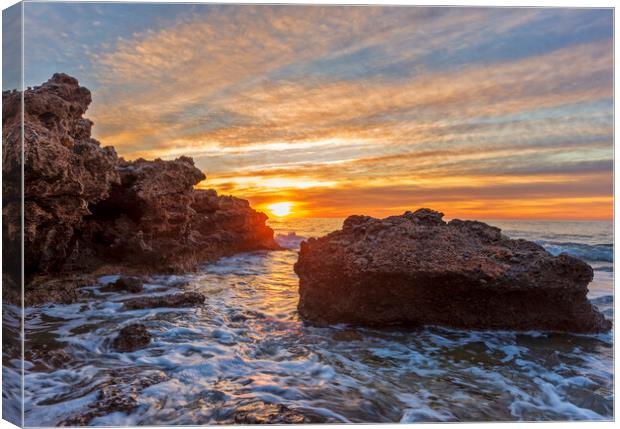 Photography with a sunrise between the rocks in a seascape Canvas Print by Vicen Photo