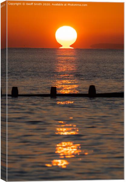 Sun touching the sea Canvas Print by Geoff Smith