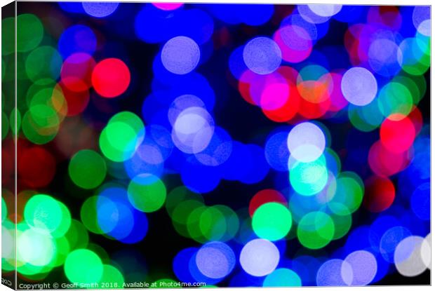 Blurred Colourful Christmas Lights Canvas Print by Geoff Smith